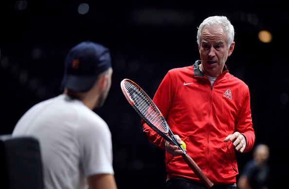 Team World captain John McEnroe discusses tactics with Jack Sock during a practice session at the O2 Arena. Credit: Getty Images