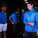 Backstage boys: Rafael Nadal waits in the wings before making an entrance.