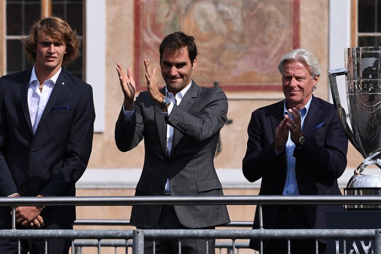 Roger Federer, Bjorn Borg and Alexander Zverev wave to the crowd