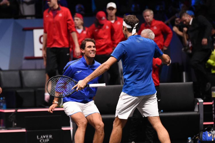 Rafael Nadal and Roger Federer celebrate victory over Team World at the inaugural Laver Cup in Prague. 