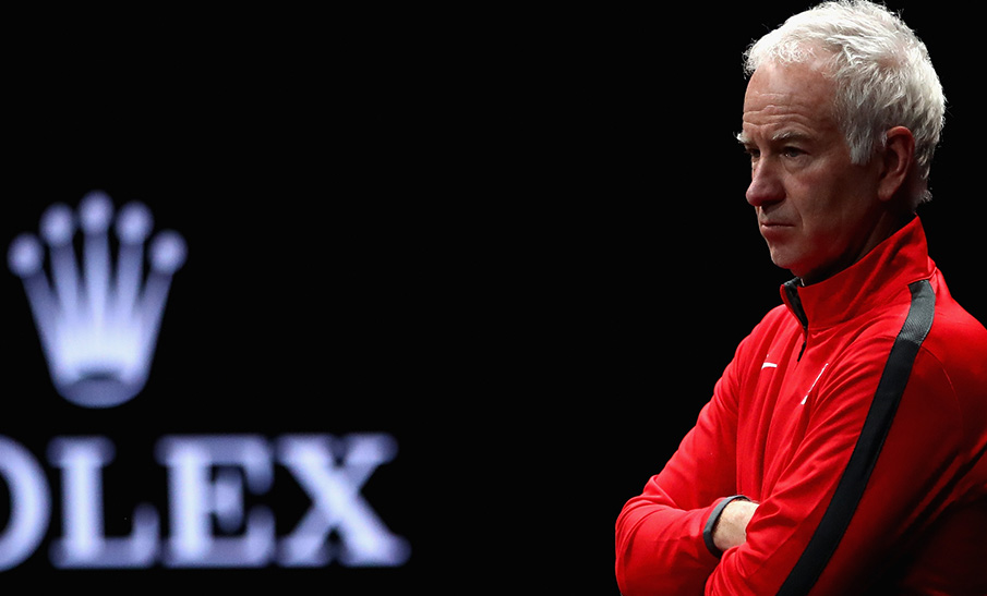 Team World captain John McEnroe watches his players practice at the O2 Arena in Prague.