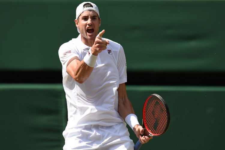 US player John Isner celebrates winning the second set against South Africa's Kevin Anderson during their men's singles semi-final match on the eleventh day of the 2018 Wimbledon Championships at The All England Lawn Tennis Club in Wimbledon, southwest London, on July 13, 2018. 