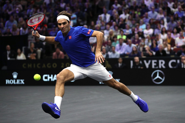 Man on the run, Roger Federer pushes hard for a win over Isner. Photo: Matthew Stockman/Laver Cup
