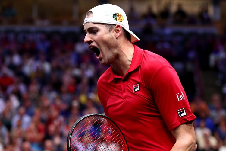 A valiant effort by John Isner, who fails to convert a match point against Roger Federer. Photo: Clive Brunskill/Getty Images