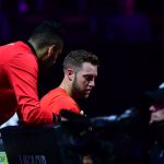 Team World's Nick Kyrgios offers advice to his friend and teammate, Jack Sock. Photo: Ben Solomon/Laver Cup