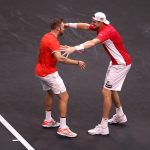Jack Sock and John Isner are elated after beating Federer and Zverev in the doubles. Photo: Clive Brunskill/Getty Images