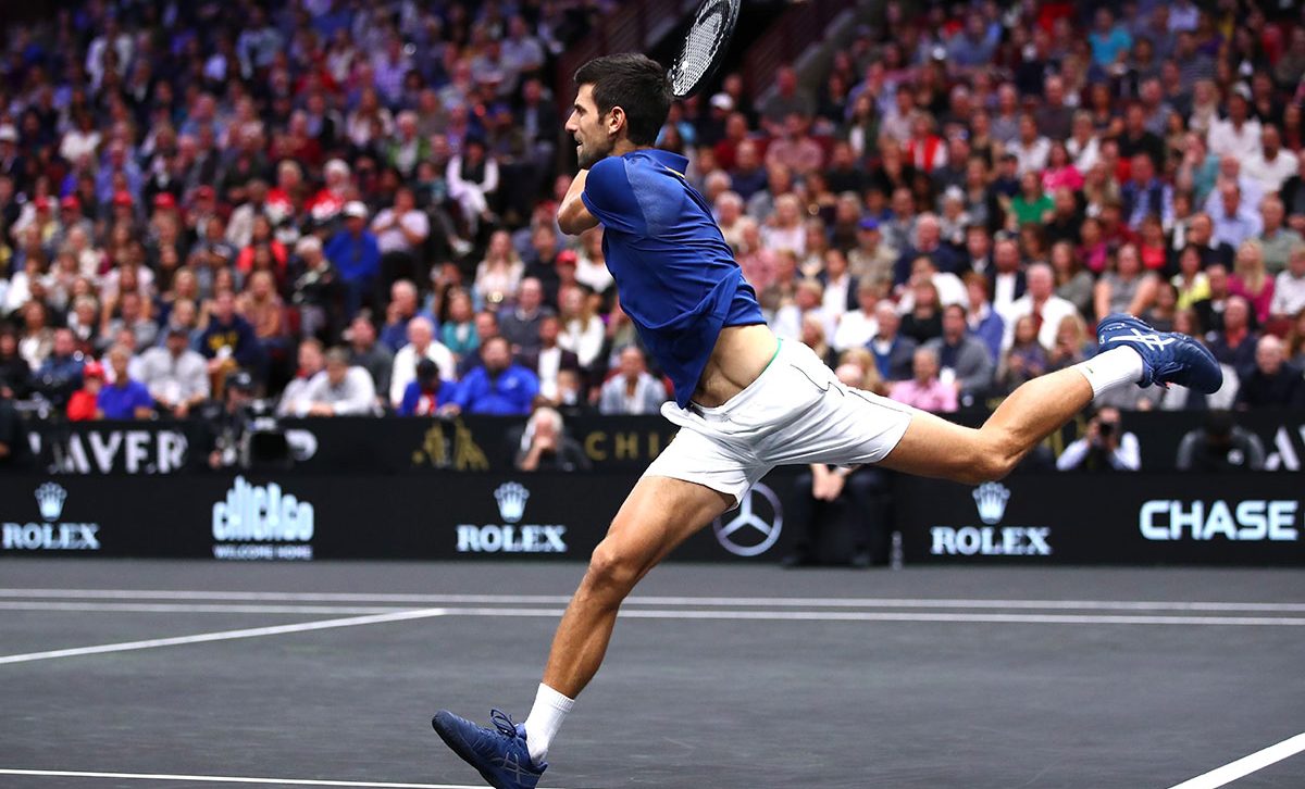 Novak Djokovic shows his incredible fitness on the run against Anderson. Photo: Clive Brunskill/Getty Images