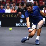 Novak Djokovic slices low and light. Photo: Clive Brunskill/Getty Images