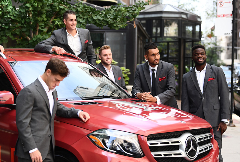 Team World players gather around their Mercedes-Benz team vehicle ahead of the Player Welcome. Photo: Ben Solomon