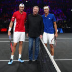 John Isner and Alexander Zverev pose with Marc Rosset at the coin toss ahead of their singles on Saturday