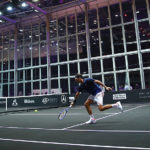 Roger Federer of Switzerland in full flight during an early practice session at the Palexpo, Geneva.