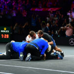 Team Europe clamber over Alexander Zverev after he defeats Milos Raonic to win the Laver Cup