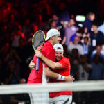 Jack Sock and John Isner celebrate the win over Federer and Tsitsipas