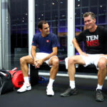 Swiss star Roger Federer takes a break during practice with Team Europe Vice Captain Thomas Enqvist.