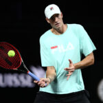 John Isner stands tall during Team World's practice at Palexpo