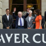 Tennis legend Rod Laver waves to the crowd at the Official Opening