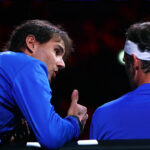 Rafael Nadal counsels Roger Federer during his close match against Nick Kyrgios.