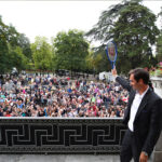Roger Federer waves to fans