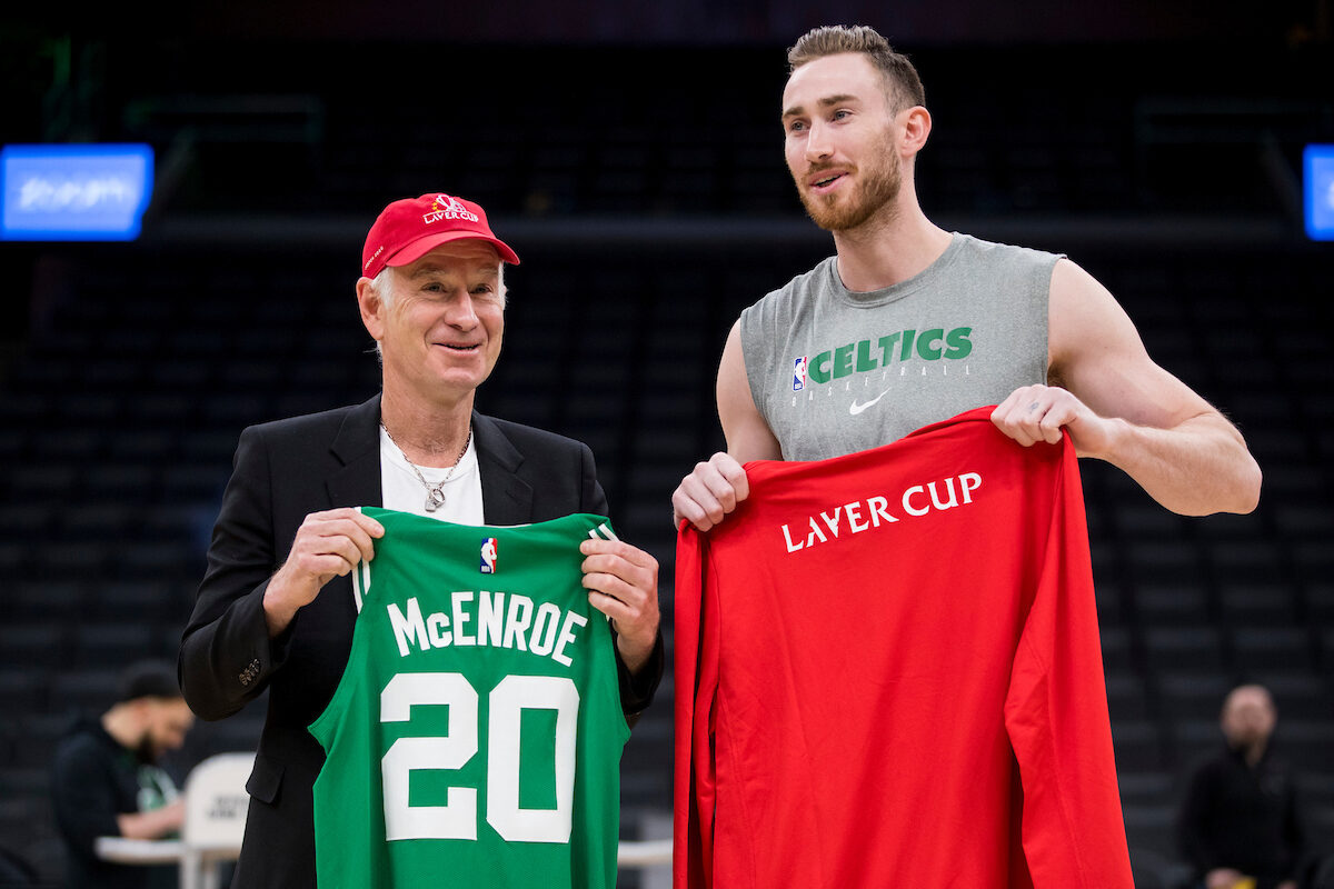 John McEnroe and Gordon Hayward #20 of the Boston Celtics exchange jerseys at TD Garden.
