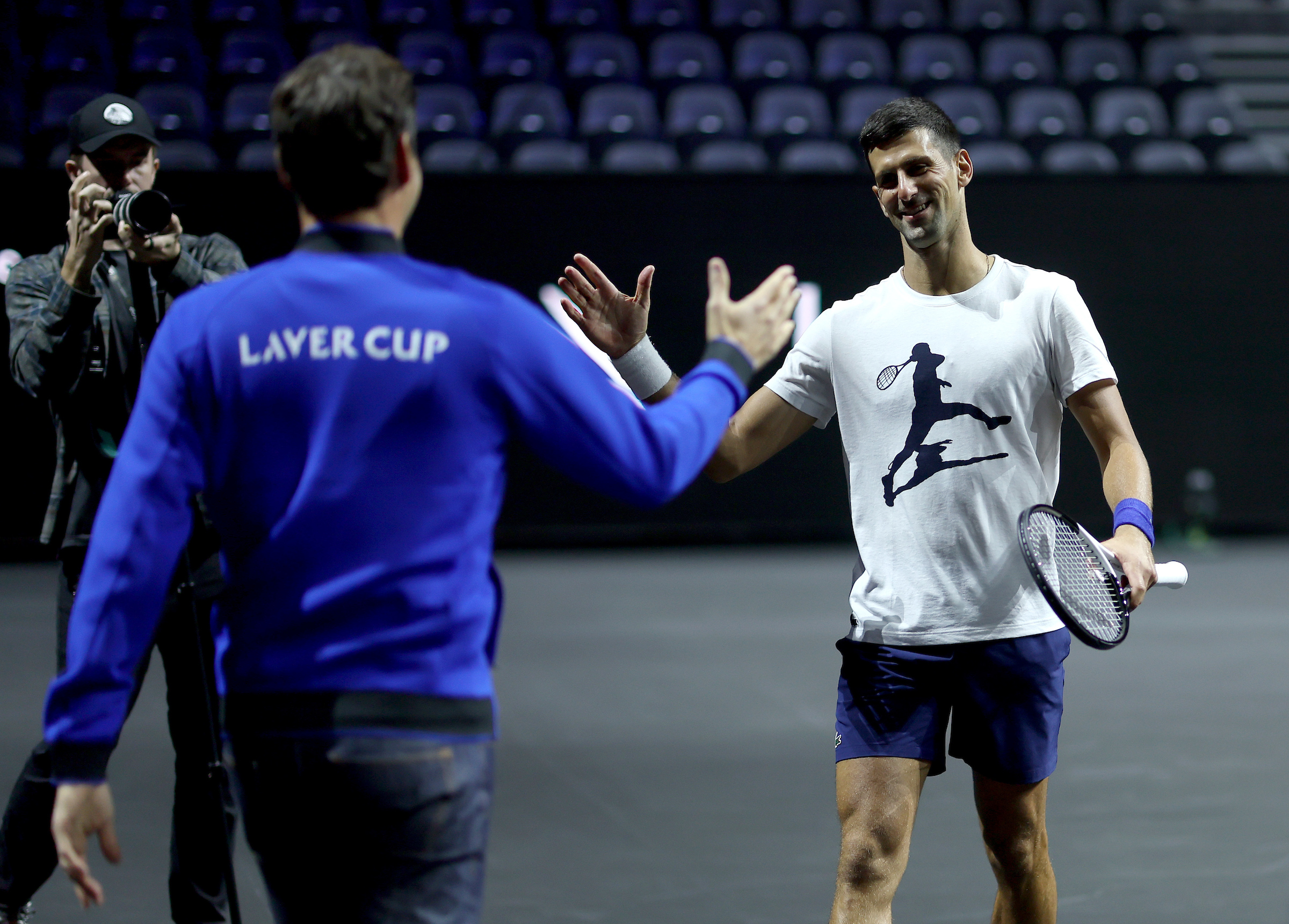 Roger Federer greets long-time rival and Team Europe teammate Novak Djokovic at The O2. 