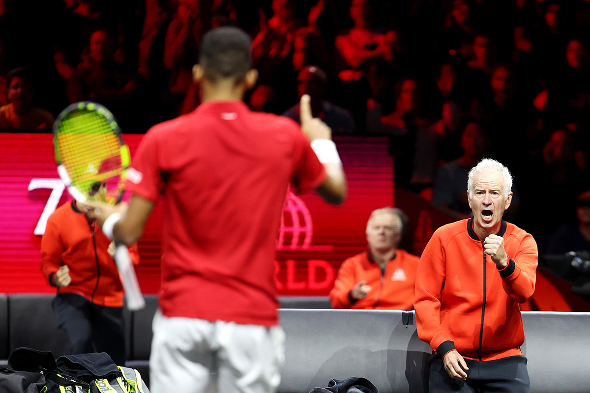 Captain John McEnroe urges on Felix Auger-Aliassime to victory in Sunday's first singles match.