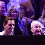 Roger Federer watches Day 3 action with Rod Laver. Photo by Jeff Vinnick/Getty Images