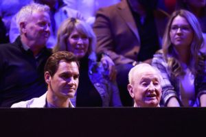 Roger Federer watches Day 3 action with Rod Laver. Photo by Jeff Vinnick/Getty Images