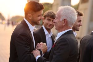 Grigor Dimitrov greets Team World Captain John McEnroe. Photo by Gerald Matzka/Getty Images