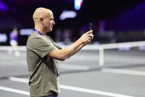 Andre Agassi documents the surroundings. Photo by Clive Brunskill/Getty Images