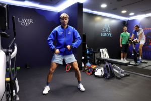 Flavio Cobolli, a reserve player for the European team, keeps an eye on the action backstage. Photo by Clive Brunskill/Getty Images