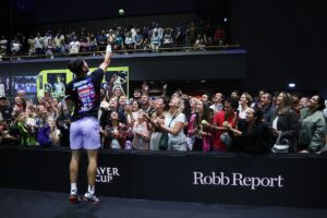 Carlos Alcaraz delights fans at a practice session. Photo by Clive Brunskill/Getty Images