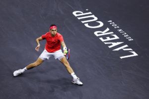 Alejandro Tabilo digs in during his night match against Grigor Dimitrov. Photo by Clive Brunskill/Getty Images