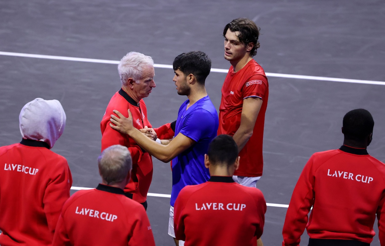 Team World Captain John McEnroe congratulates Team Europe's star player, Carlos Alzaraz. 