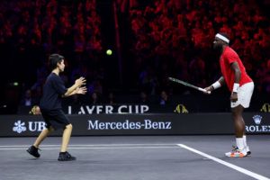 Frances Tiafoe connects with a Laver Cup ballkid. Photo by Maja Hitij/Getty Images