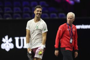 Team World's Thanasi Kokkinakis practices under the watchful eye of Captain John McEnroe. Photo by Maja Hitij/Getty Images