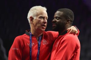 Team World Captain John McEnroe greets Frances Tiafoe. Photo by Maja Hitij/Getty Images