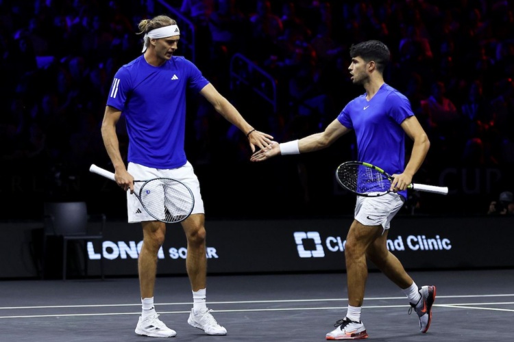 Alexander Zverev and Carlos Alcaraz of Team Europe celebrate a point against Taylor Fritz and Ben Shelton of Team World on Friday night in Berlin 2024.