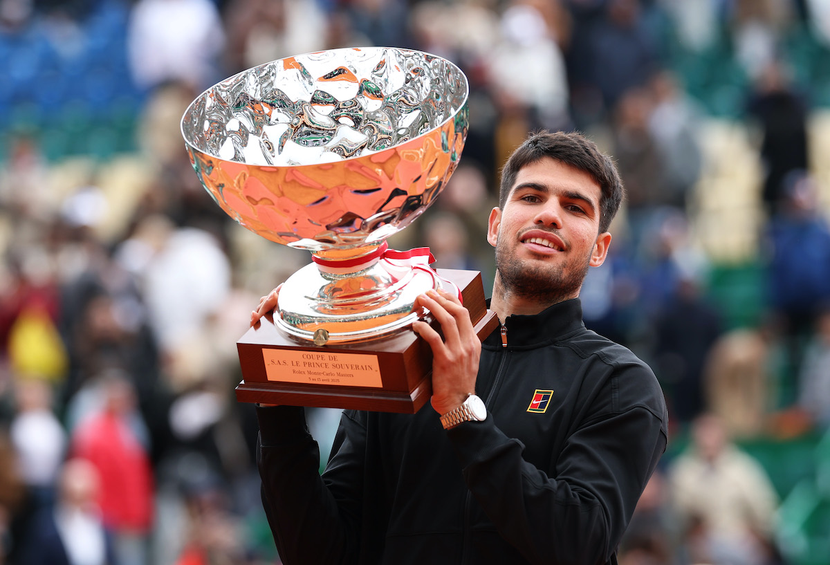 Team Europe's Carlos Alcaraz holds the trophy after winning the final of the Rolex Monte-Carlo Masters at Monte-Carlo Country Club on April 13, 2025 (Photo by Clive Brunskill/Getty Images).