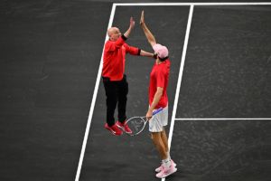 A high five moment between Captain Agassi and Opelka.