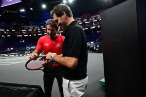 Pat Rafter and Roger Federer check out the equipment. Photo: Ben Solomon/Laver Cup