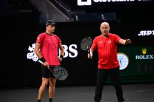 Eight-time Grand Slam champion Andre Agassi gives Team World alternate Jenson Brooksby some tips. Photo: Ben Solomon/Laver Cup