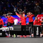 Team World Captain Andre Agassi releases the tension.