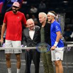 Legends Rod Laver and John McEnroe at the first match coin toss.