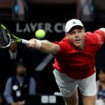 Alex Michelsen lunges for a forehand.