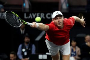 Alex Michelsen lunges for a forehand.