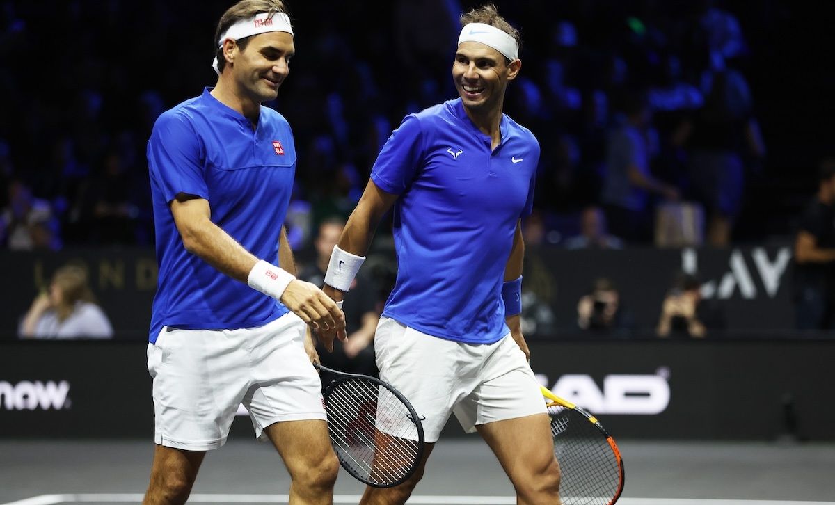 LONDON, ENGLAND - SEPTEMBER 23: Roger Federer and Rafael Nadal of Team Europe interact during the doubles match between Jack Sock and Frances Tiafoe of Team World and Roger Federer and Rafael Nadal of Team Europe during Day One of the Laver Cup at The O2 Arena on September 23, 2022 in London, England. (Photo by Clive Brunskill/Getty Images for Laver Cup) Laver Cup 2022 – Day One