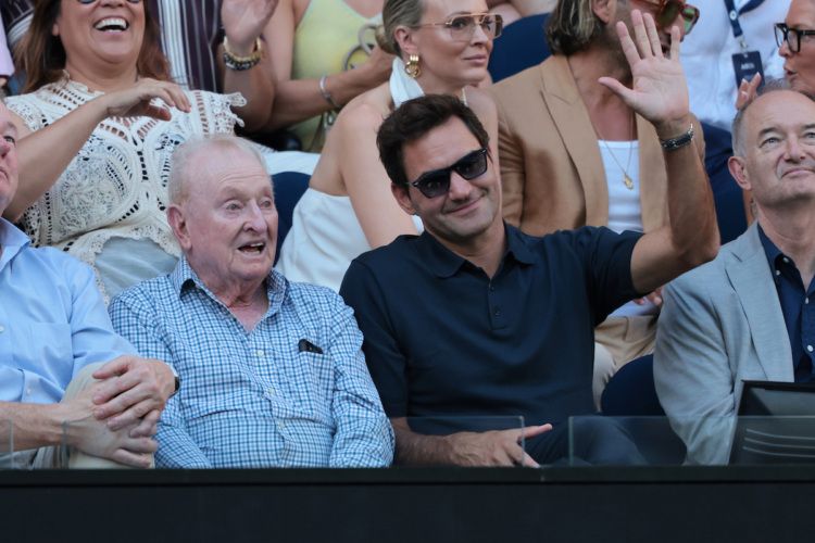 Roger Federer spent time during his Melbourne visit watching centre court action at Rod Laver Arena with Rod Laver.