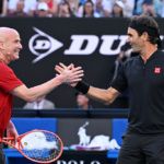 Roger Federer partners with Andre Agassi at the AO Opening Ceremony.
