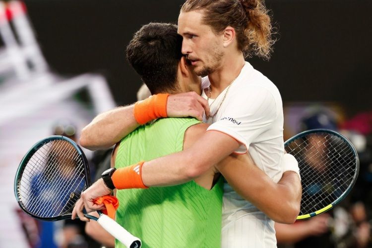Alexander Zverev and Carlos Alcaraz embrace after their five-hour, 27-minute semifinal. 