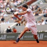 Zverev stretches for a backhand.